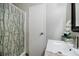 This bathroom features a shower with a decorative shower curtain and a spacious vanity at 5200 Peachtree Rd # 1104, Atlanta, GA 30341