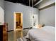 Bedroom with doors to the bathroom and closet, and a ladder to a higher area at 5200 Peachtree Rd # 1104, Atlanta, GA 30341