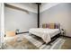 Simple bedroom with neutral tones, polished concrete floor, and plenty of natural light at 5200 Peachtree Rd # 1104, Atlanta, GA 30341