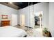 Spacious bedroom with doors to the bathroom and closet, featuring high ceilings at 5200 Peachtree Rd # 1104, Atlanta, GA 30341