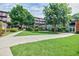A beautiful condo building with well-manicured landscaping and lush green lawn at 5200 Peachtree Rd # 1104, Atlanta, GA 30341