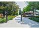 Well maintained community trail with mature trees, manicured shrubs and directions to points of interest at 5200 Peachtree Rd # 1104, Atlanta, GA 30341