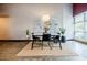 Bright dining space with modern table and natural light from large windows at 5200 Peachtree Rd # 1104, Atlanta, GA 30341