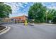 Exterior of community building with gated access and well-maintained landscaping, enhancing the property's appeal at 5200 Peachtree Rd # 1104, Atlanta, GA 30341