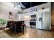 Modern kitchen with stainless steel appliances, island with bar stools, and ample countertop space at 5200 Peachtree Rd # 1104, Atlanta, GA 30341