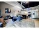 Open-concept living room featuring high ceilings, modern decor, and a seamless transition to the kitchen at 5200 Peachtree Rd # 1104, Atlanta, GA 30341