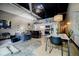 Spacious living room featuring modern furnishings, high ceilings, and an open layout with kitchen and dining area at 5200 Peachtree Rd # 1104, Atlanta, GA 30341