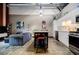 Open-concept living area features a modern kitchen, island seating and industrial details at 5200 Peachtree Rd # 1104, Atlanta, GA 30341