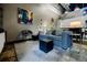 Cozy living room with a modern gray sofa, gray rug, and industrial-style accents at 5200 Peachtree Rd # 1104, Atlanta, GA 30341