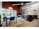Bright living space with exposed brick accent wall and floor to ceiling windows at 5200 Peachtree Rd # 1104, Atlanta, GA 30341