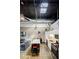 Spacious living area features a kitchen, an island table, and high ceilings at 5200 Peachtree Rd # 1104, Atlanta, GA 30341
