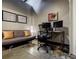 This home office features a comfortable sofa and functional desk for a productive work from home experience at 5200 Peachtree Rd # 1104, Atlanta, GA 30341