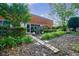 Lush outdoor patio features a stone path, privacy hedges, and seating area for relaxation and enjoyment of nature at 5200 Peachtree Rd # 1104, Atlanta, GA 30341
