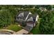 Aerial view of home showcasing the manicured lawn and mature trees surrounding the property at 15 Saddlebrook Ct, Covington, GA 30016