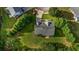 Overhead aerial view showcasing the backyard featuring lush greenery and surrounding trees for added privacy at 15 Saddlebrook Ct, Covington, GA 30016