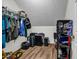 Well-organized closet with wood laminate floor and shelving units, providing ample storage solutions at 15 Saddlebrook Ct, Covington, GA 30016