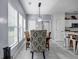 Inviting dining area featuring ample natural light and stylishly appointed seating, enhancing the home's charm at 15 Saddlebrook Ct, Covington, GA 30016