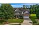 Charming two-story home with a manicured front lawn and an attached two-car garage at 15 Saddlebrook Ct, Covington, GA 30016