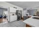 Bright kitchen featuring white cabinets, stainless steel appliances, and an open layout at 15 Saddlebrook Ct, Covington, GA 30016