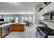 Spacious kitchen featuring stainless steel appliances, modern fixtures, and generous counter space at 15 Saddlebrook Ct, Covington, GA 30016