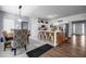 Open concept kitchen with a large island, white cabinets, and stainless steel appliances at 15 Saddlebrook Ct, Covington, GA 30016