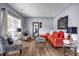 Stylish living room with hardwood floors, modern furniture, and ample natural light at 15 Saddlebrook Ct, Covington, GA 30016