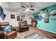 Comfortable living room featuring hardwood floors, leather furniture, and entertainment decor at 15 Saddlebrook Ct, Covington, GA 30016