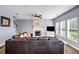 Comfortable living room with a fireplace, large sectional sofa, and plenty of natural light at 15 Saddlebrook Ct, Covington, GA 30016