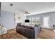 Spacious living room with fireplace, hardwood floors, and large windows for ample light at 15 Saddlebrook Ct, Covington, GA 30016
