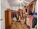 Organized walk-in closet features ample storage space for clothing, shoes, and accessories at 15 Saddlebrook Ct, Covington, GA 30016