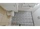 A cozy bathroom featuring tile floors, vanity cabinet, and a unique patterned shower curtain at 3440 Wilson Rd, South Fulton, GA 30349