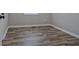 An empty bedroom featuring stunning wood floors and natural light from a window at 3440 Wilson Rd, South Fulton, GA 30349