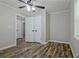 Bedroom featuring hardwood flooring, neutral color palette, and a closet at 3440 Wilson Rd, South Fulton, GA 30349