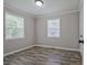 The bedroom has natural lighting, wood floors, and a modern ceiling light fixture at 3440 Wilson Rd, South Fulton, GA 30349