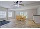 Dining area features tile floors, a ceiling fan and lots of natural light from multiple windows at 3440 Wilson Rd, South Fulton, GA 30349