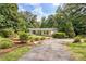 Quaint home with beautiful landscaping and mature trees at 3440 Wilson Rd, South Fulton, GA 30349