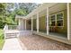 Covered front porch with white support columns and wood flooring at 3440 Wilson Rd, South Fulton, GA 30349