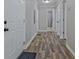 Well-lit hallway with wood floors offers multiple rooms and entryways at 3440 Wilson Rd, South Fulton, GA 30349
