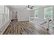 Upstairs living space features hardwood flooring and ample windows providing natural light at 3440 Wilson Rd, South Fulton, GA 30349