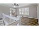 Upstairs living space with hardwood flooring, wainscoting and access to a dining area at 3440 Wilson Rd, South Fulton, GA 30349