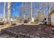 Backyard entertaining space featuring a fire pit and patio at 5050 Brownwood Dr, Powder Springs, GA 30127