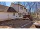 Exterior angle view of the home's back deck and patio at 5050 Brownwood Dr, Powder Springs, GA 30127