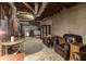 Basement area with furniture, concrete floor, and partial furnishings, showing potential living space at 5050 Brownwood Dr, Powder Springs, GA 30127