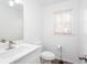 Bathroom with a window, modern fixtures, and a sink at 5050 Brownwood Dr, Powder Springs, GA 30127