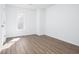 Bright bedroom features clean, white walls and light wood grain flooring at 5050 Brownwood Dr, Powder Springs, GA 30127