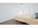 Bright bedroom features a ceiling fan, white walls and light wood grain flooring at 5050 Brownwood Dr, Powder Springs, GA 30127
