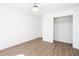 Well lit bedroom offering wood look flooring and a spacious closet at 5050 Brownwood Dr, Powder Springs, GA 30127