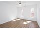 Bright bedroom with natural light and wood look flooring at 5050 Brownwood Dr, Powder Springs, GA 30127