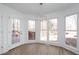 Bright dining area with backyard views, lovely hanging light fixture and easy access to the outdoor deck at 5050 Brownwood Dr, Powder Springs, GA 30127