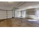 Spacious two-car garage with shelving and two garage doors, offering convenient parking and storage at 5050 Brownwood Dr, Powder Springs, GA 30127
